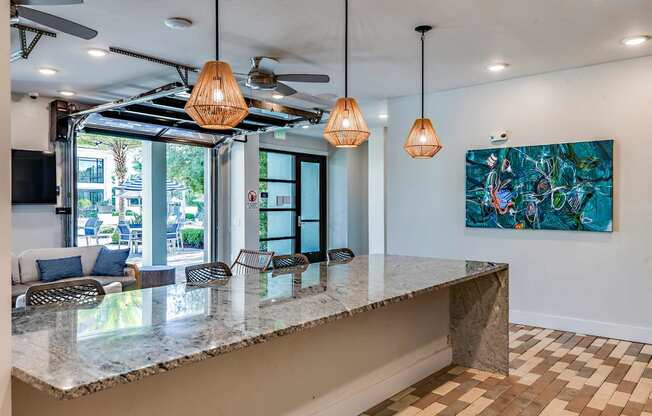 a kitchen with a counter top and a large window