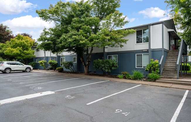 A parking lot with a car parked in the first spot.
