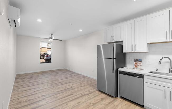a kitchen with a sink and a refrigerator