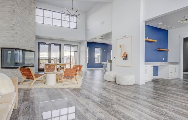 a living room with white walls and a blue accent wall at Copper 87, Utah