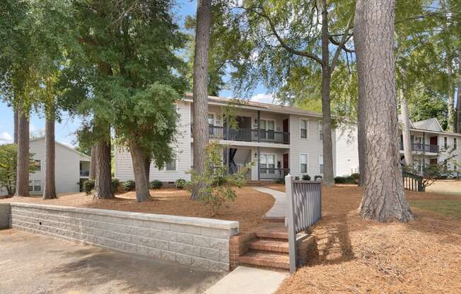 A tree in front of a building.