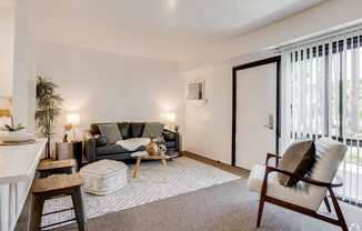 a living room with a couch and a chair at University Park, Azusa, CA 91702