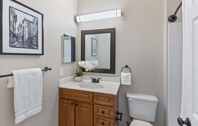 A bathroom with a towel hanging on a towel rack.