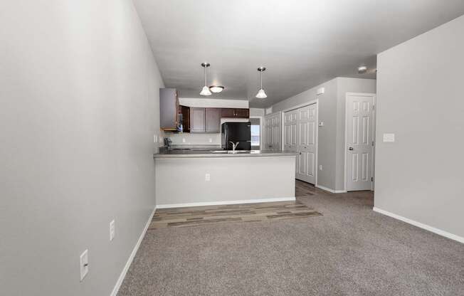 A spacious kitchen area with a countertop and cabinets.