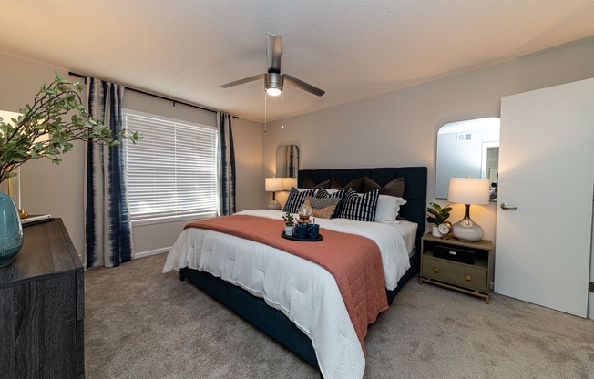 Cozy bedroom with carpet & overhead lighting