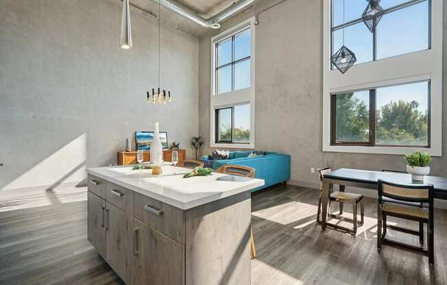 A kitchen with a large island and a dining table. at The Mansfield at Miracle Mile, Los Angeles, CA, 90036