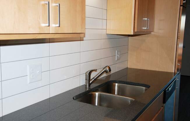 Kitchen with tile backsplash and granite countertops