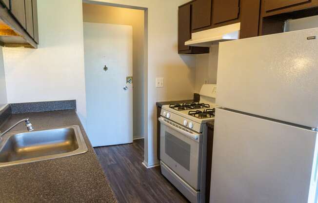 Fully equipped kitchen at Golf Manor Apartments in Roseville, Michigan