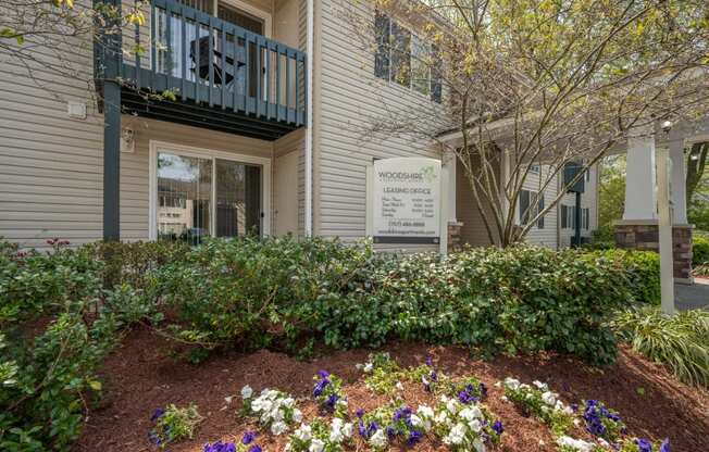 a flower garden in front of a building