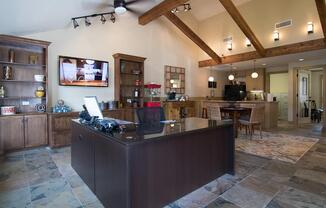 a view of a living room filled with furniture and a fireplace