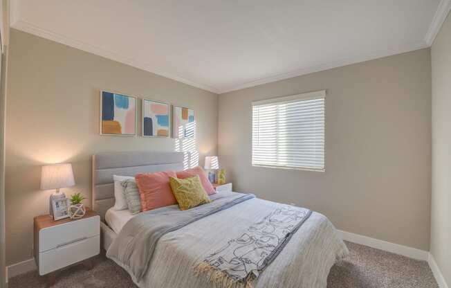 Two Bedroom Apartments in Moreno Valley CA - Ardella on Chagall - Bedroom with Bed, Nightstands, Lamps, Wall Decor, and Window