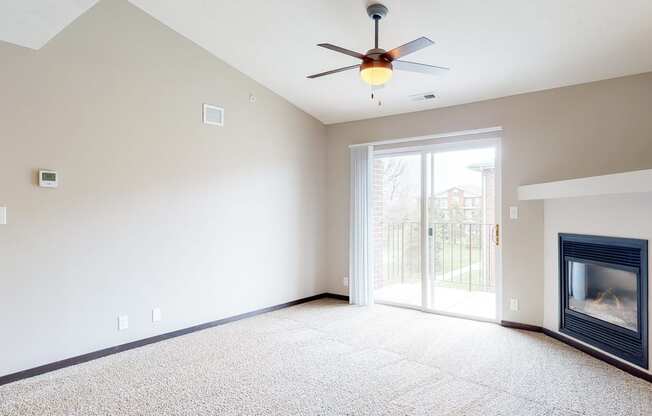 Renovated living room with high ceilings and gas fireplace at Northridge Heights in Lincoln
