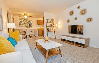 a living room with a couch coffee table and fireplace