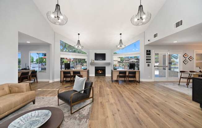 a living room with couches and chairs and a fireplace