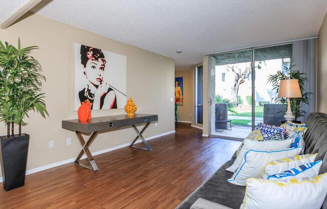 a living room filled with furniture and a flat screen tv