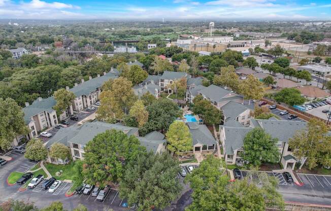 an aerial view of a neighborhood with houses and trees