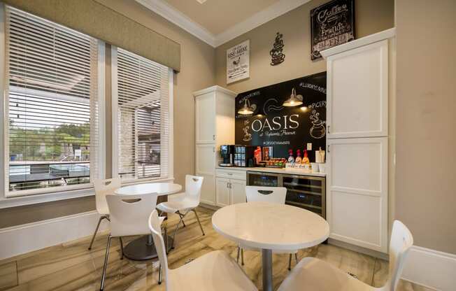 a dining room with tables and chairs and a bar