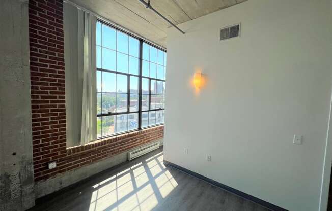 a view of a large window in a room with white walls