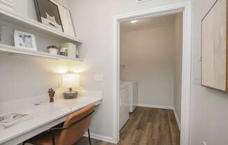 a home office with a desk and a hallway to a bathroom at Sladestone Shadow Creek, Texas