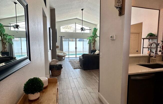 Modern three-bedroom, two-bathroom pool home with EXTRA BONUS ROOM! A MUST SEE!