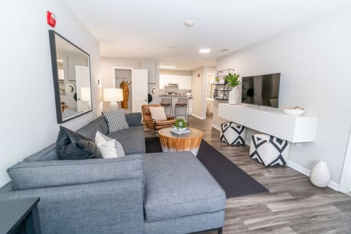 a living room with a couch and a tv at Merion Milford Apartment Homes, 06460