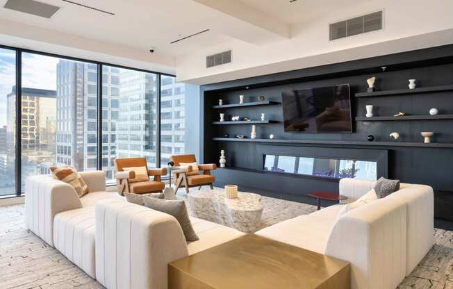 a living room filled with furniture and a large window at 220 Meridian, Indianapolis, IN 46204