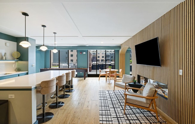 a lobby with a bar and chairs and a television at EagleRidge Plaza Residences, North Dakota, 58104