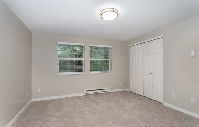 Novela Apartments Bedroom with Window and Closet Doors