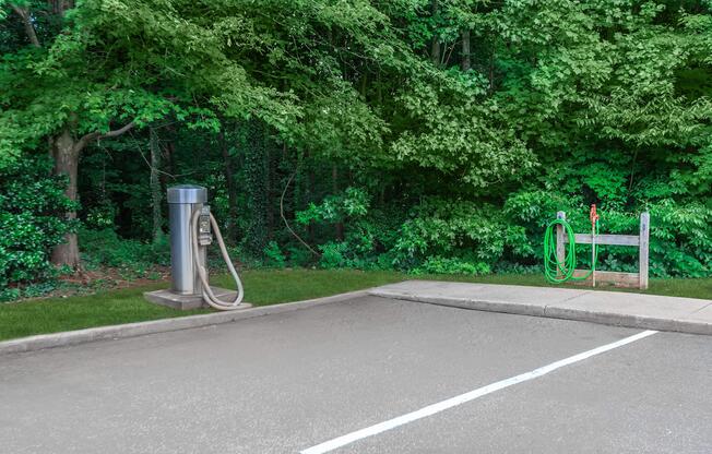 Parking spot with car cleaning equipment at Ashley Oaks Apartments in Greensboro, North Carolina