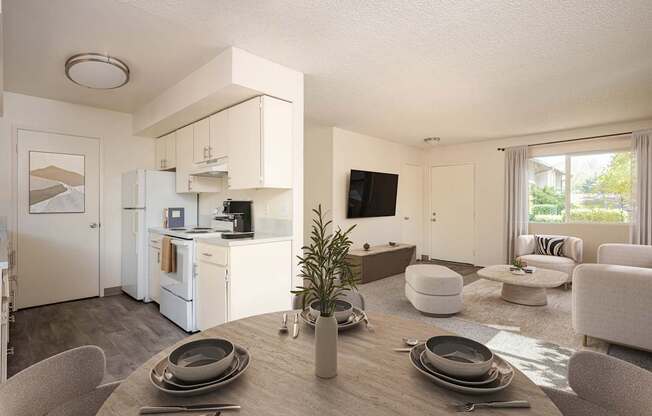 A modern kitchen with a dining table set for two.
