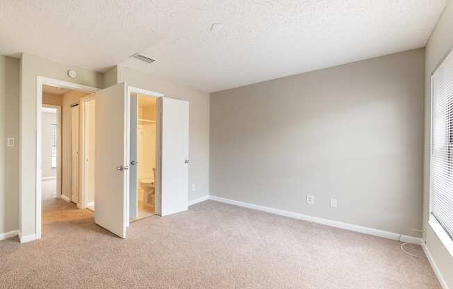 A room with a carpeted floor and a white ceiling.