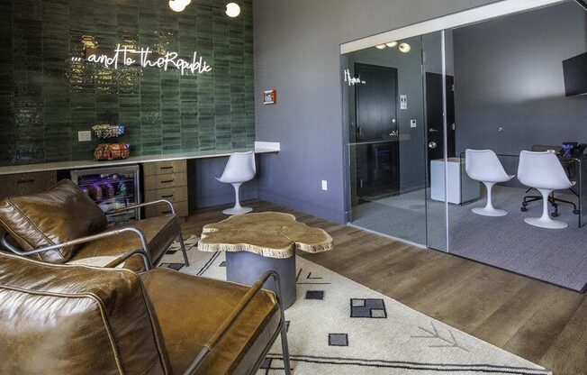 A modern living room with a brown leather chair and a glass wall.