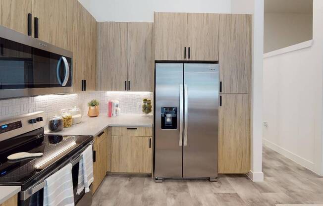 Gourmet kitchens with stylish mosaic tile, quartz countertops and plentiful storage. Some homes feature double-door refrigerators with water dispensers and dedicated pantry space too!