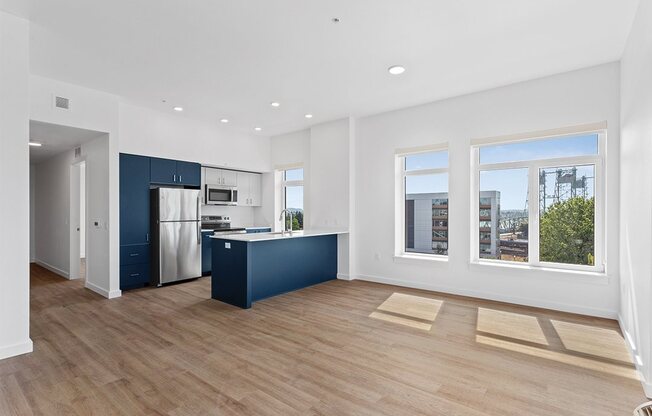 a kitchen with a blue island in the middle of a room