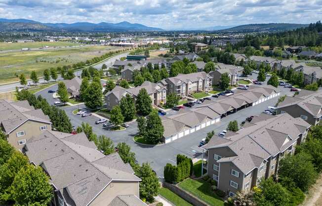 an aerial view of a neighborhood with houses and trees