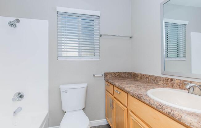 a kitchen with a sink and a mirror