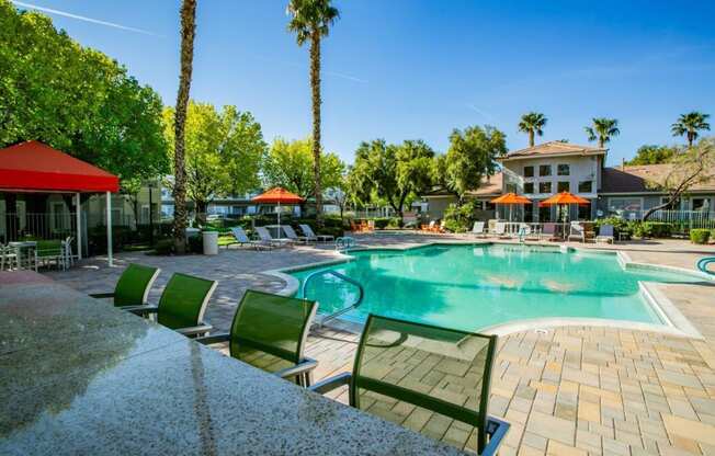 Octave Apartments in Las Vegas, Nevada Clubhouse Exterior and Large Pool with Lounge Chairs at Octave Apartments, Las Vegas