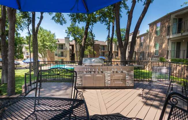 This is a photo of BBQ area/patio at Canyon Creek Apartments in Dallas, TX.