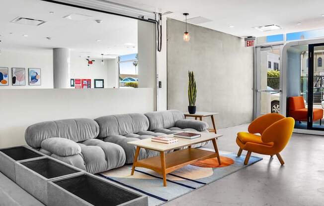 a living room with gray couches and a coffee table