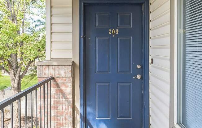 the front door of a house with a blue door