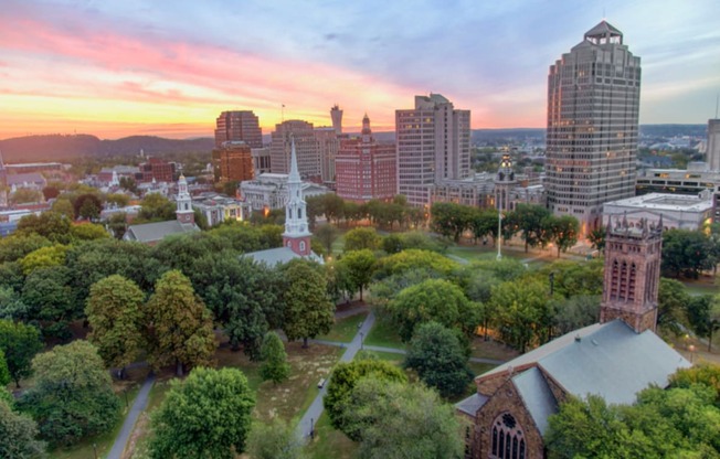 an aerial view of the city at sunset