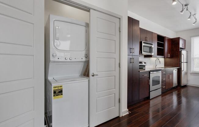 12 South Apartments - Nashville TN - kitchen with dark wood cabinets and stainless steel appliances