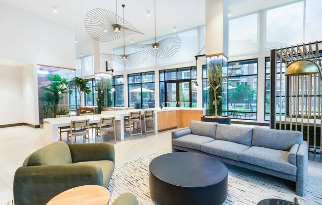 Stylish and inviting lounge space with high ceilings and modern seating—perfect for casual conversation or quiet moments.