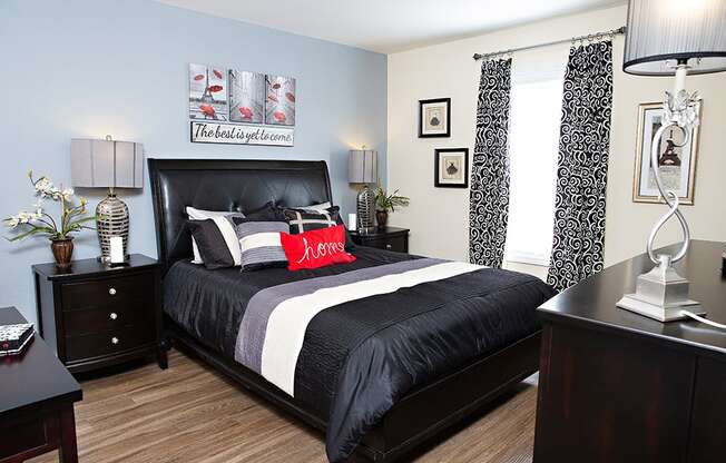 Bedroom with accent wall and queen size bed