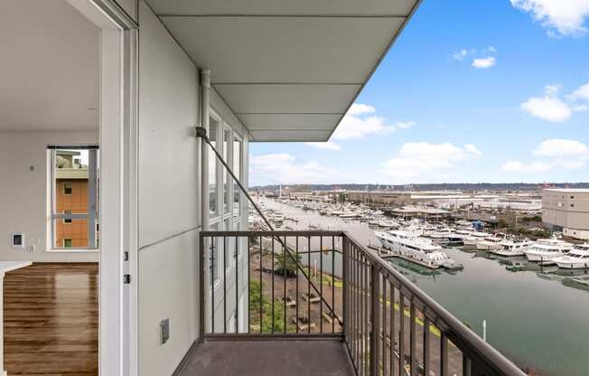 a balcony with a view of a marina and a river