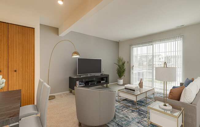 Muscari Layout Model Living Room with Patio Access at Portsmouth Apartments, Novi, MI
