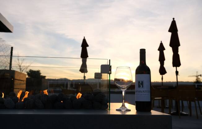 bayswater rooftop lounge and fireplace at sunset at Bayswater Apartments, Burlingame