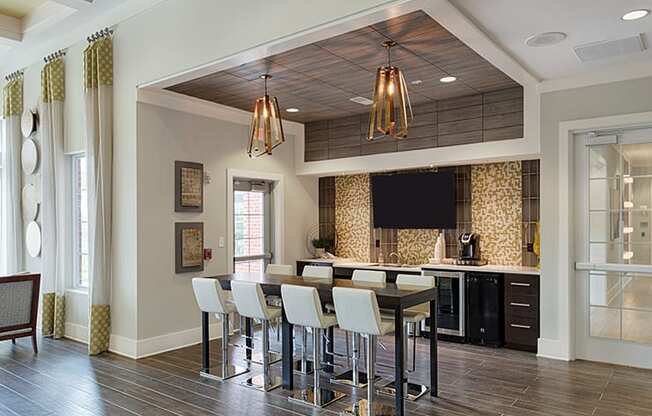 Clubhouse with bar area; flat screen TV; tables and chairs