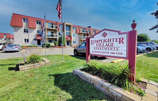 an apartment building with a sign