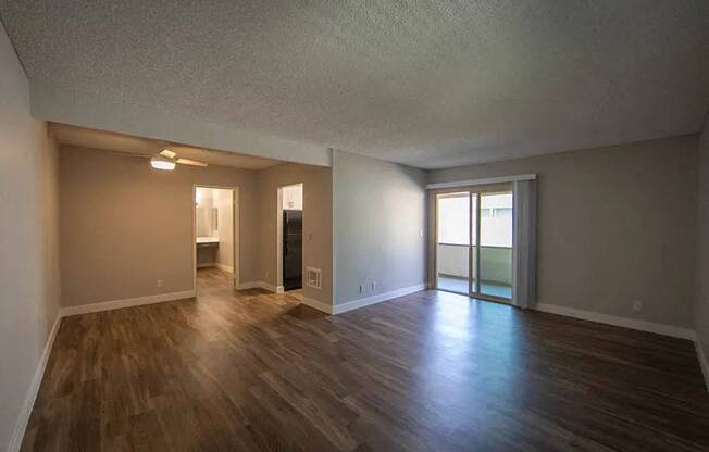 an empty living room with a hard wood floor at Aspire Upland Apartments, California